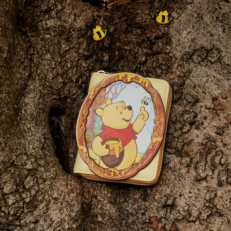 Winnie The Pooh Cameo Wallet nestled in a tree surrounded by some fake bees